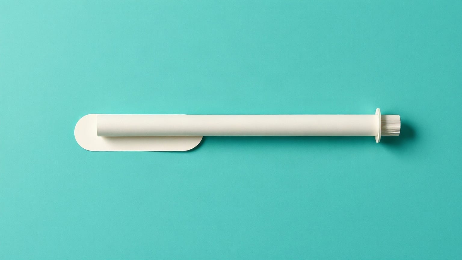 A long chalk-white paper tube crossing a deep teal ground, a pale aqua circle at its leading end and a small sand-coloured marker behind it